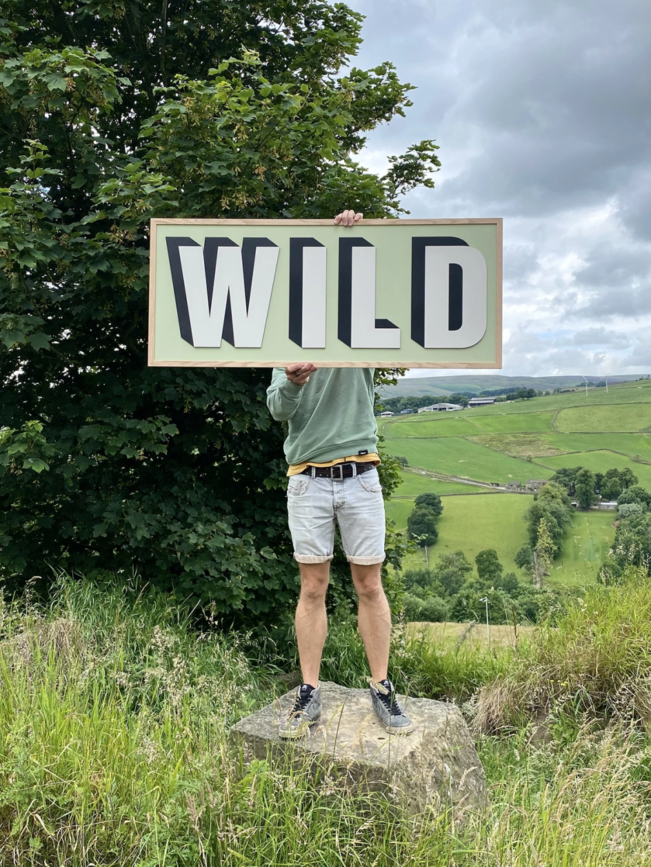 Wild Wooden Sign by Modo & Co. Photo via [Holly.co](https://holly.co/)